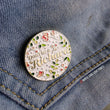 Load image into Gallery viewer, This round floral pins and says "don't be a Richard", it measures 1 1/4" along the longest edge.