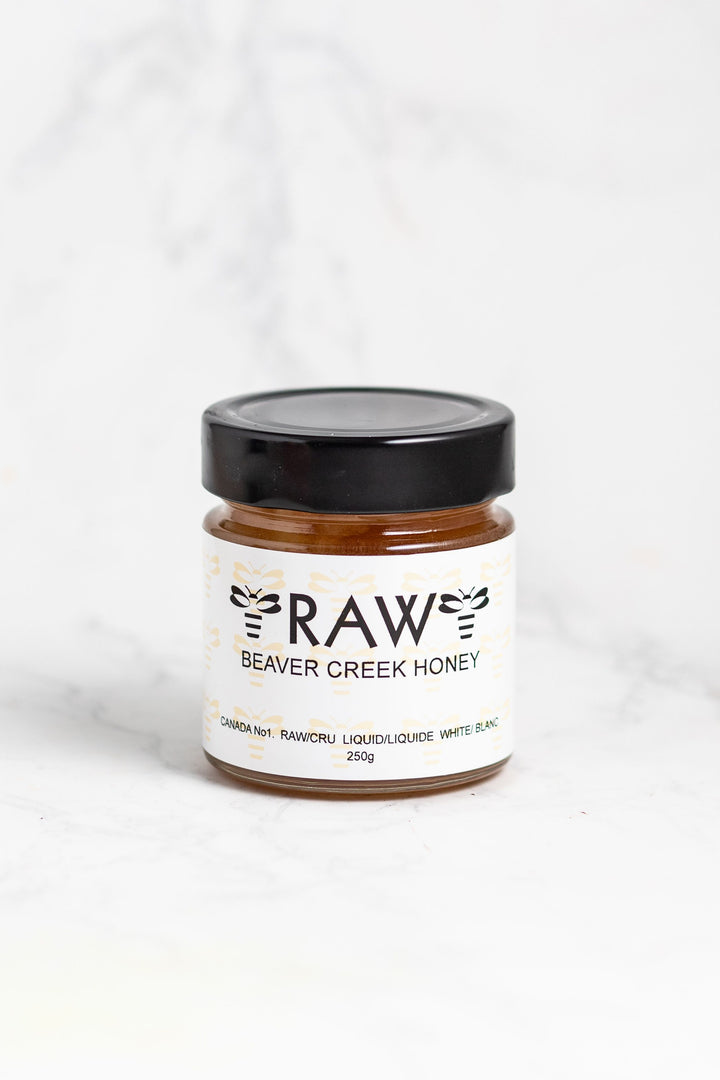 250g jar of raw, unprocessed honey strained to remove smaller wax and other particles.