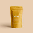 Load image into Gallery viewer, A 100g bag of Turmeric Blume Blend can make approximately 30 lattes.