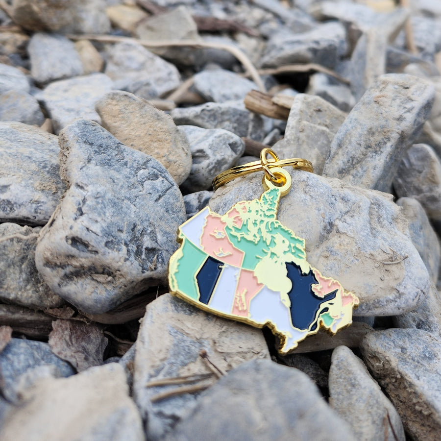 Each Canada shaped pendant measures 1.75" on the longest/widest edge. Additionally is the keyring and one jump ring.