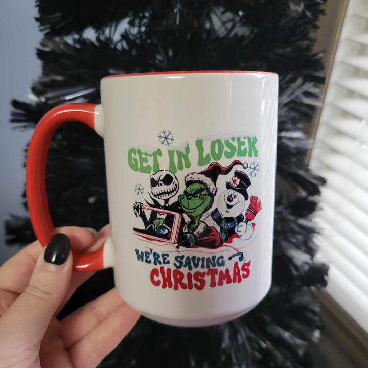 All Decked Out 15oz ceramic mug that says "Get in loser we're saving Christmas" with Jack Skellington, the Grinch, and Frost the Snowman in a car