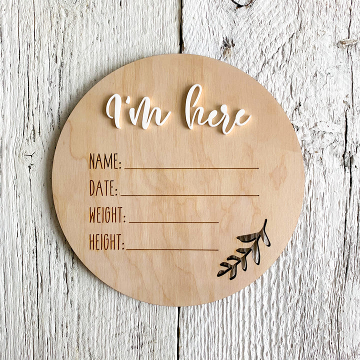 Laser engraved baby stats plaque that says "I'm here" with a place to put your babies name, weight, height, and day of birth.