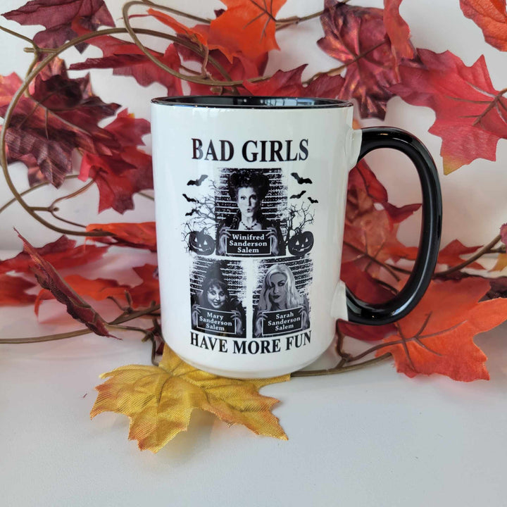 15oz ceramic mug with headshots of Winifred, Sarah, and Mary from "Hocus Pocus" and says "Bad girls have more fun". Mug is dishwasher safe but handwash is recommended
