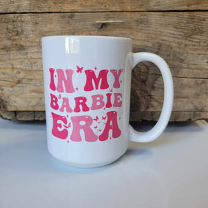 15oz cermic mug that says "in my Barbie Era" in pink letters with butterflies, dishwasher safe, handwash recommended