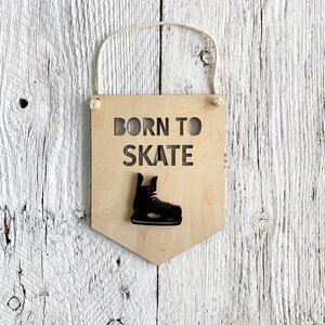 Laser engraved 3D wall flag that says "Born To Skate" with a hockey skate on it