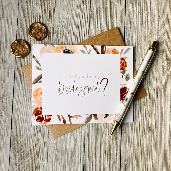 Floral wedding card that says "Will you be my bridesmaid?", 10% of proceeds donated to Canadian charities assisting families coping with miscarriage and loss, the inside is blank