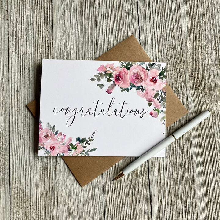 Floral card that says "Congratulations", 10% of proceeds donated to Canadian charities assisting families coping with miscarriage and loss, the inside is blank