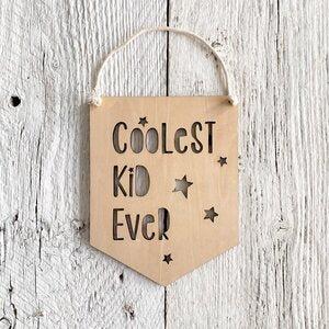 Laser engraved wall flag that says "Coolest Kid ever".
