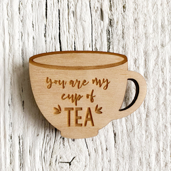 2 inch plywood magnet in the shape of a tea cup that says "you are my cup of tea".