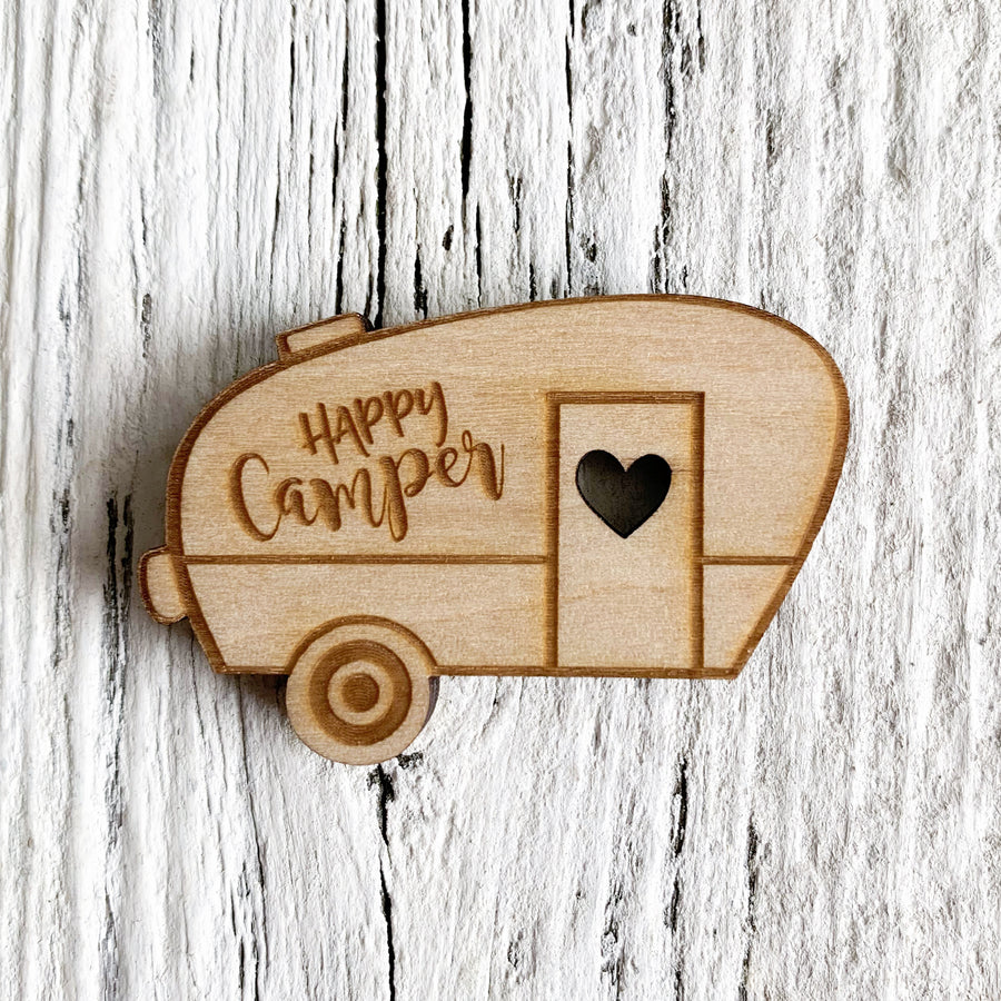 2 inch birch plywood magnet in the shape of a trailer with the words "Happy camper".