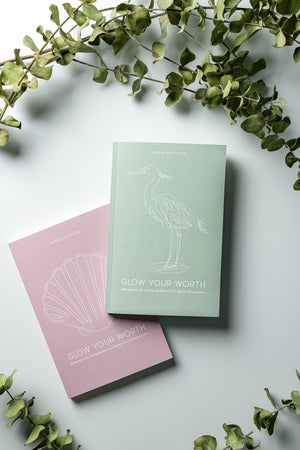 Glow Your Worth guides you through your self-worth healing journey,  helping you transmute doubt and fear into passion and purpose.  The pink book focuses on igniting uncoditional love while the green journal focuses on igniting abundance.
