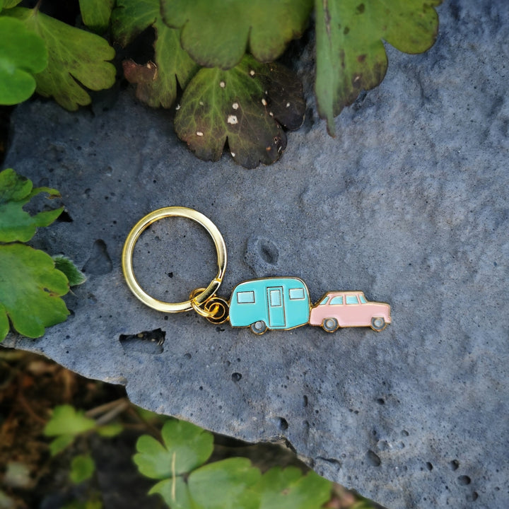 Each Happy Camper pendant measures 1.75" on the longest/widest edge and has a pink truck with a light blue trailer. Additionally is the keyring and one jump ring.
