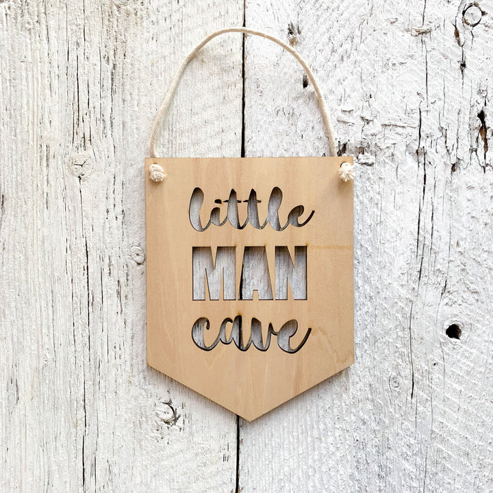 Laser engraved wall flag that says "Little Man Cave".