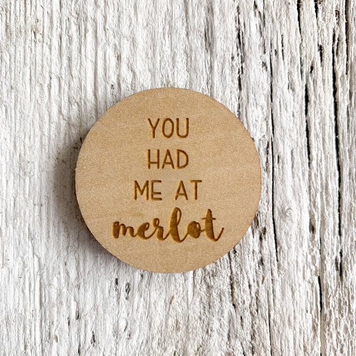 2 inch birch plywood magnet that says "you had me at merlot".
