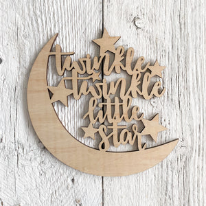 Laser engraved wooden sign that says "Twinkle Twinkle Little Star" with a sky scape design.