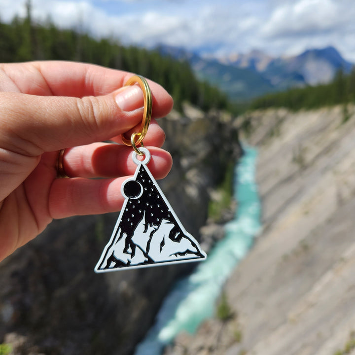 Each mountain pendant measures 1.75" on the longest/widest edge. Additionally is the keyring and one jump ring.