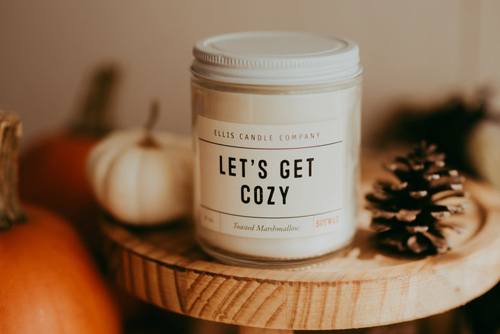 This 8oz candled called "Let's Get Cozy" smells of toasted marshmallow and will burn for 40+ hours. The candles is made  using all natural soy wax, a wood wick, and no dyes.