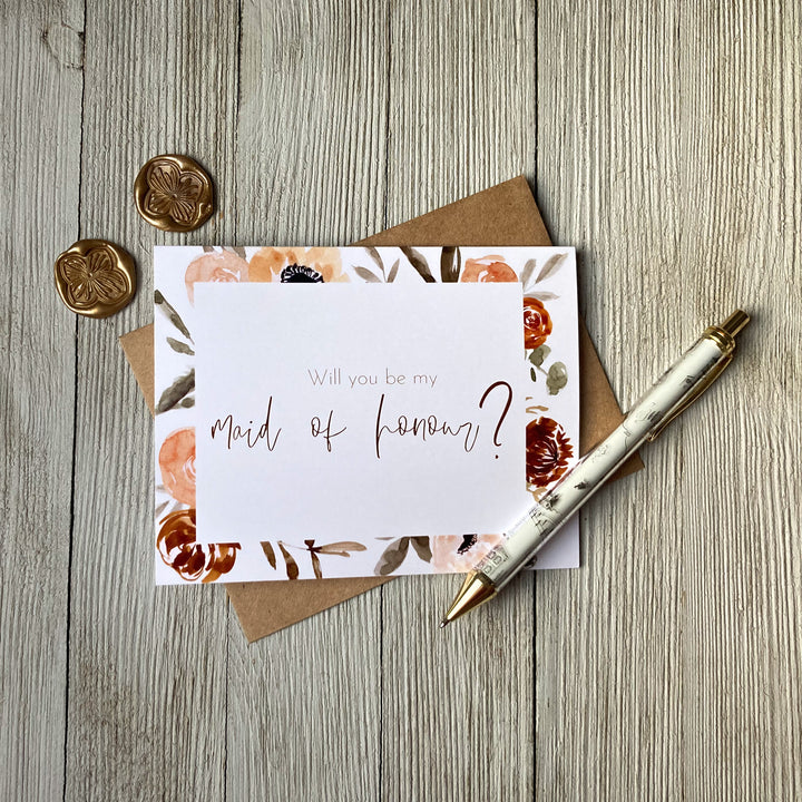 Floral wedding card that says "Will you be my maid of honour?", 10% of proceeds donated to Canadian charities assisting families coping with miscarriage and loss, the inside is blank