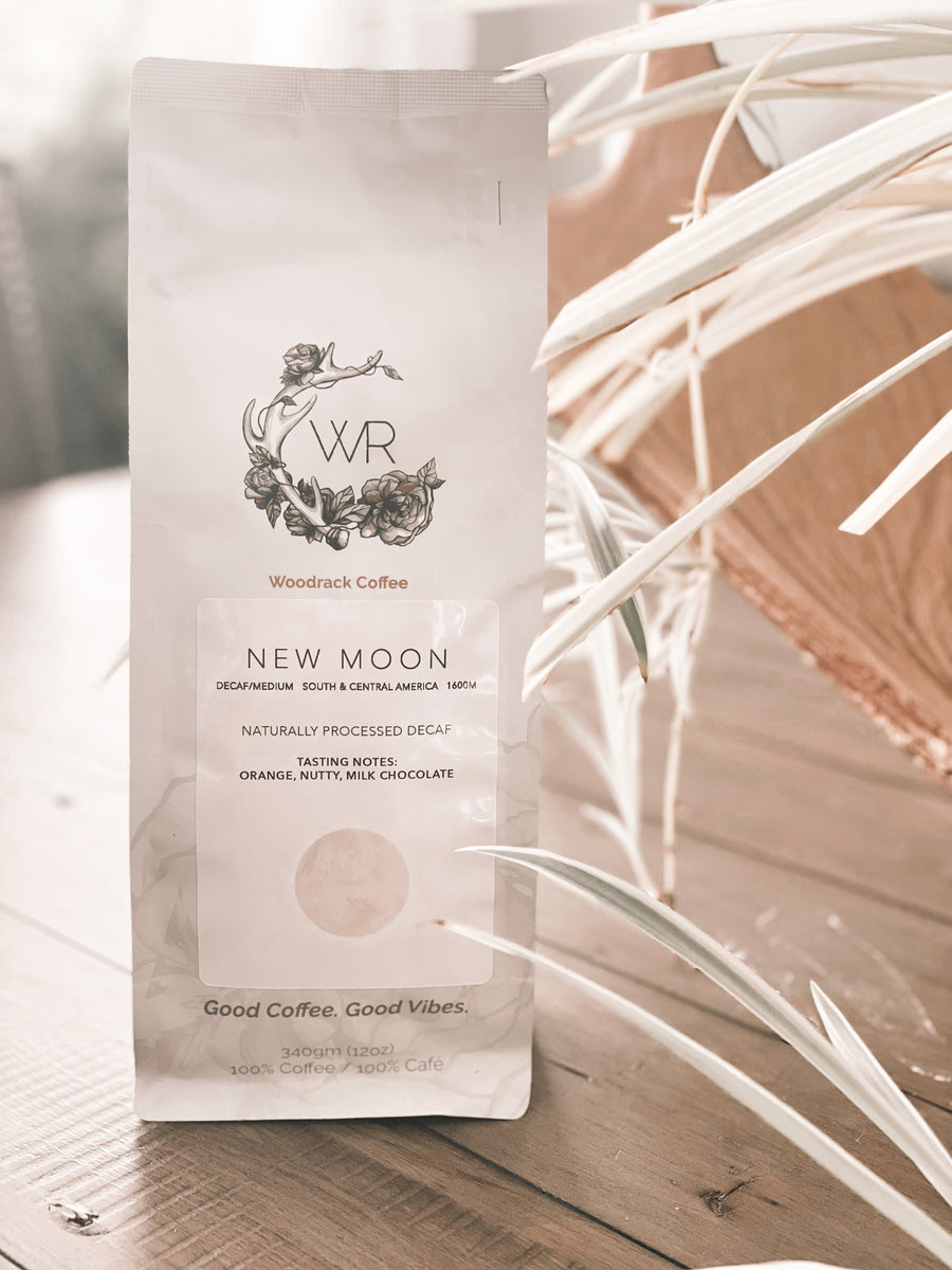 New Moon coffee from Woodrack Cafe. Medium roast whole bean decaf coffee come from South and Central America. Tasting notes of Orange, Nutty, Milk Chocolate.