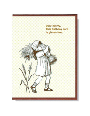 This A2 size (4.25” x 5.5”) birthday card is digitally printed on creamy linen stock with gold foil stamped by hand in studio, is blank inside and comes with a recycled envelope. The front of the card has a little girl carrying a bundle of wheat and says "Don't worry. This birthday card is gluten-free" in gold lettering.