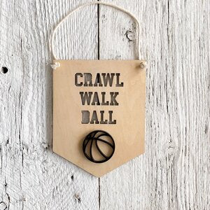 Laser engraved 3D wall flag that says "Crawl walk ball" with a basketball