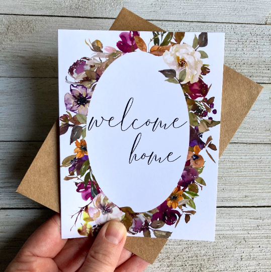 Floral card that says "welcome home", 10% of proceeds donated to Canadian charities assisting families coping with miscarriage and loss, the inside is blank