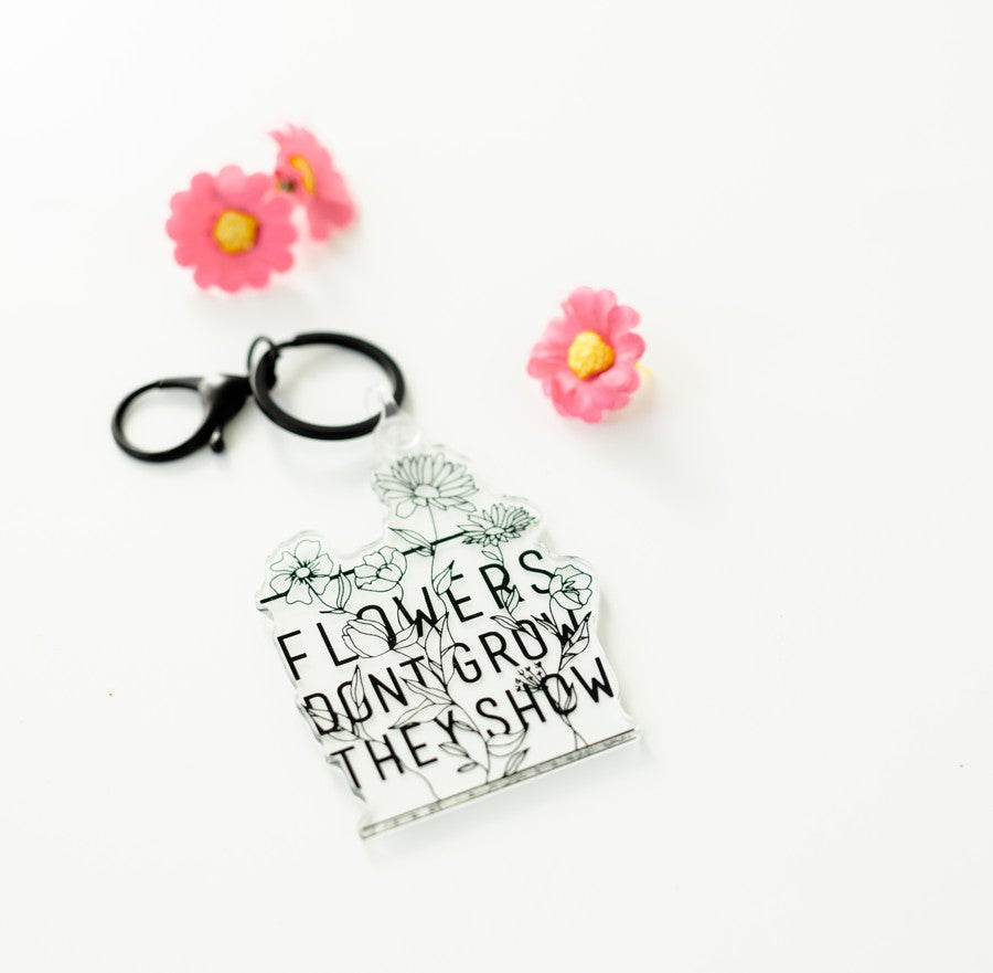 Flowers Don't Grow Keychain