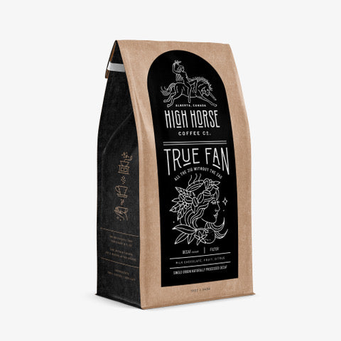 High Horse Coffee Co. True Fan whole bean decafe coffee with tasting notes of milk chocolate, fruit, and citrus.