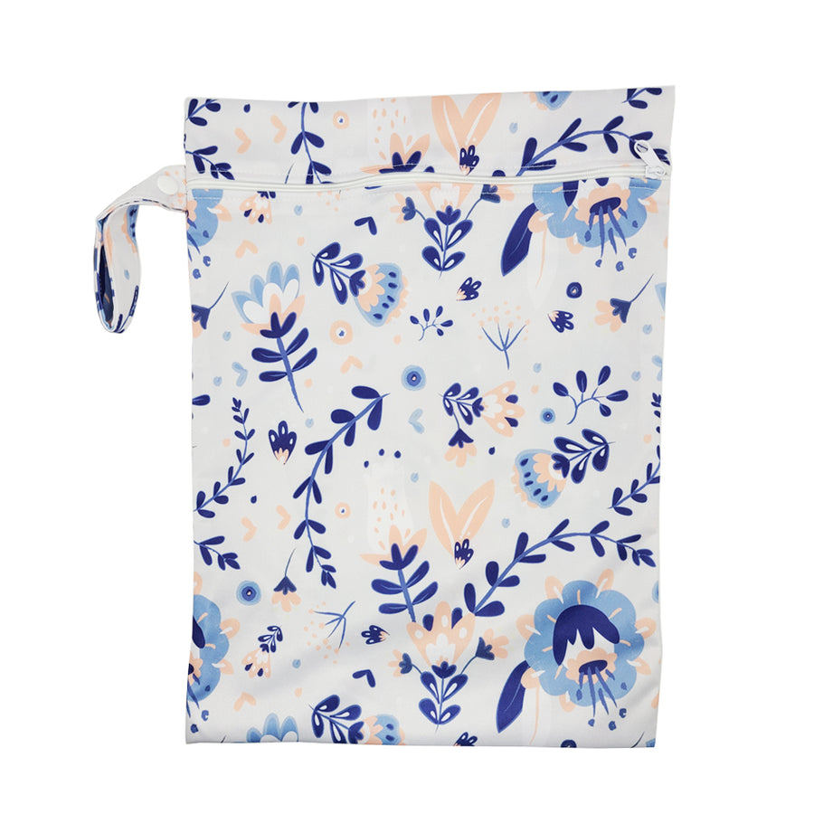 These bags are for storing dirty diapers until laundry day. They go right into the washing machine with the diapers. Wet Bag in "in the garden" with a light cream background and delicate pale blue and pink flowers