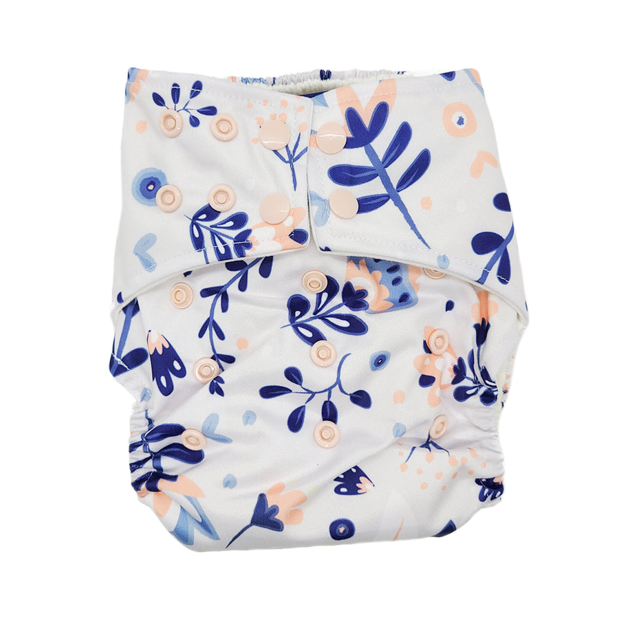 Cloth diaper in "in the garden", light cream background with delicate pale blue and pink flowers with light pink buttons