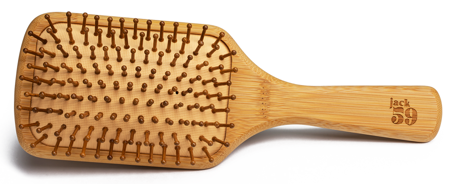 Jack59's sustainable bamboo hair brush has smooth, rounded bamboo bristles to massage and stimulate the scalp and a natural rubber base for added cushion. Our bamboo brushes are 100% plastic free, vegan, and biodegradable. We have chosen this bamboo paddle brush for its large surface area to help reduce breakage and increase blood flow to your scalp, gently stimulating with every stroke. 