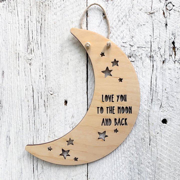 Laser engraved moon shaped wall flag that says "Love you to the moon and back".