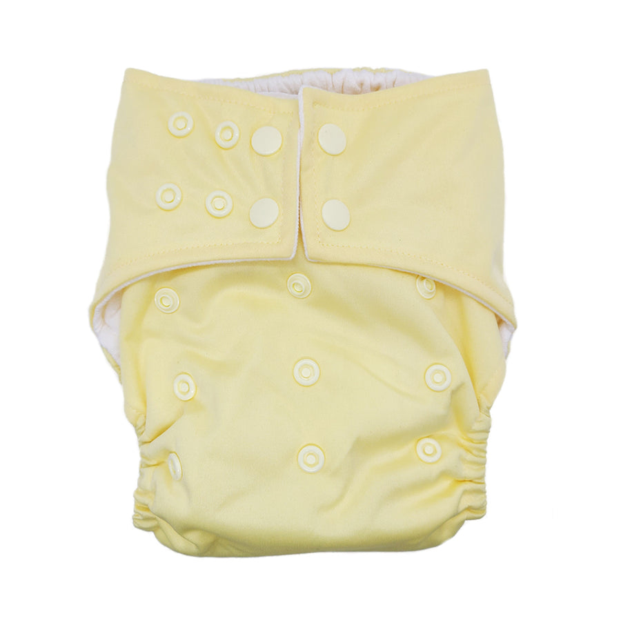 Cloth diaper in "Vanilla butter" yellow with white buttons