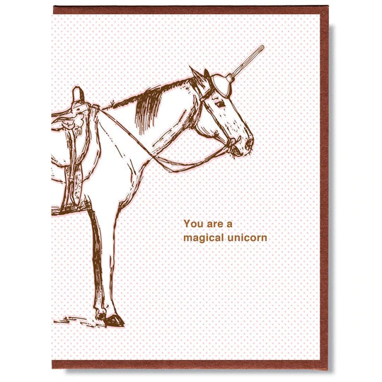 This A2 size (4.25” x 5.5”) card is digitally printed and gold foil pressed, is blank inside and comes with a recycled envelope. The front of the card has a horse with a plunger on it's head and says "you are a magical unicorn" in gold lettering.