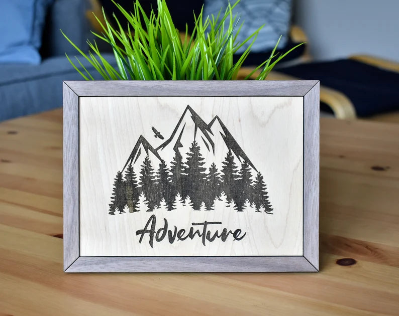58 Studios Adventure sign with a laser engraved mountain scape