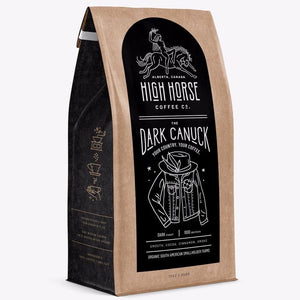 High Horse Coffee Co. Dark Canuck dark roast whole bean coffee with tasting notes of smooth cocoa, cinnamon, and smoke.