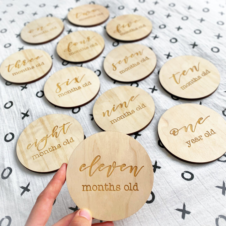 12 Plaques (1 month old - 1 year old)  Disc circles are 4” in diameter and made out of 1/4'' baltic birch plywood.