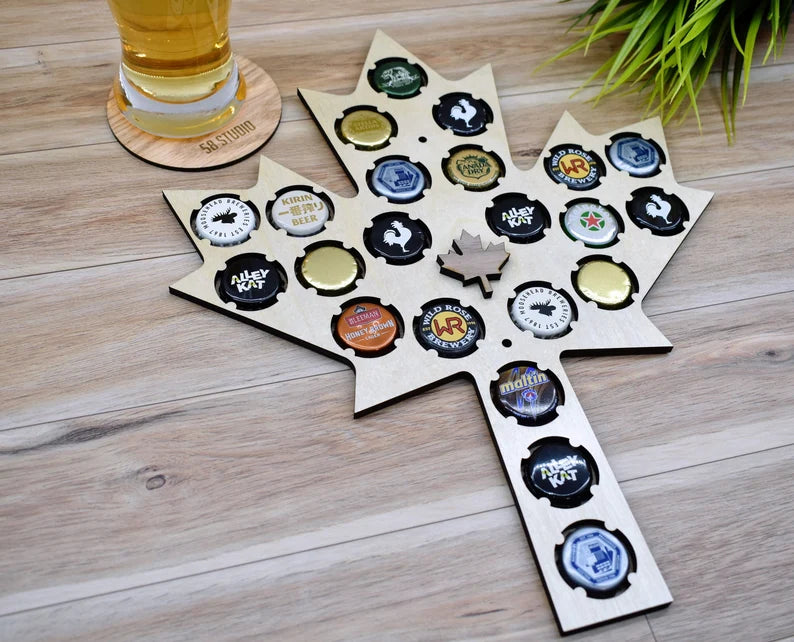 Great looking Canadian maple leaf made out of plywood with holders for bottle caps. Create your own custom collection of bottle caps from your favorite drinks and hang it on the wall for a great personalized decoration that everyone will notice. The map is made out of strong 1/4 inch birch plywood with a light smooth shiny finish. A total of 22 cap holding positions that will fit standard 27mm crown caps.
