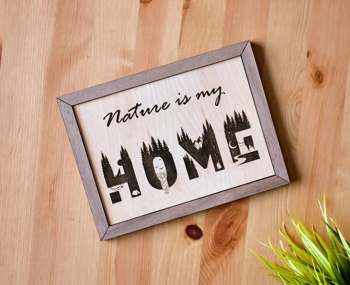 58 Studio wood sign that says "Nature is my Home" in a laser engraved natural font