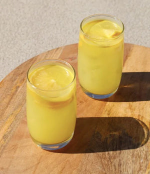Iced turmeric drink made from the turmeric Blume blend.